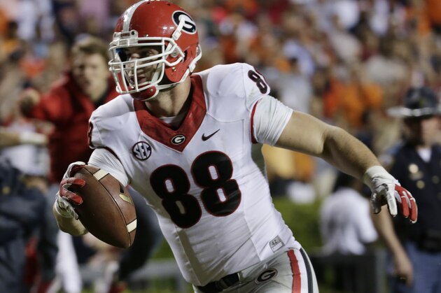 Georgia tight end Arthur Lynch (88) scores on a 24 yard touchdown reception during the second half of an NCAA college football game in Auburn, Ala., Saturday, Nov. 16, 2013. Auburn beat Georgia 43-38. (AP Photo/Dave Martin)