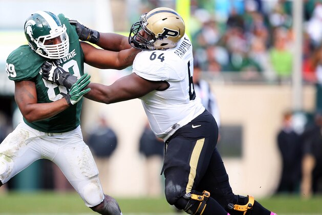 Oct 19, 2013; East Lansing, MI, USA; Michigan State Spartans defensive end Shilique Calhoun (89) defends against Purdue Boilermakers offensive tackle Kevin Pamphile (64) during the 2nd half at Spartan Stadium. MSU won 14-0. Mandatory Credit: Mike Carter-USA TODAY Sports