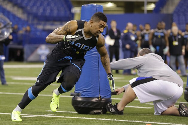 Ball State defensive lineman Jonathan Newsome runs a drill at the NFL football scouting combine in Indianapolis, Monday, Feb. 24, 2014. (AP Photo/Michael Conroy)