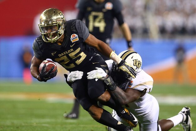 Jan 1, 2014; Glendale, AZ, USA; Baylor Bears running back Lache Seastrunk (25) runs the ball in the second quarter against the Central Florida Knights during the Fiesta Bowl at University of Phoenix Stadium. Mandatory Credit: Mark J. Rebilas-USA TODAY Sports