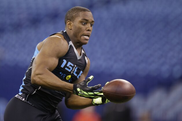 USC linebacker Devon Kennard runs a drill at the NFL football scouting combine in Indianapolis, Monday, Feb. 24, 2014. (AP Photo/Michael Conroy)