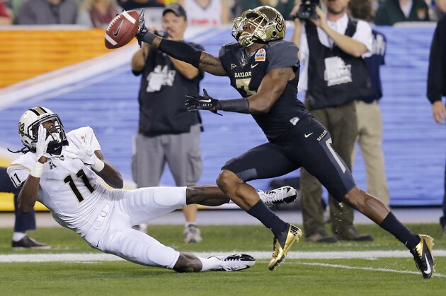 Baylor cornerback Demetri Goodson, right, breaks up a pass intended for Central Florida wide receiver Breshad Perriman during the first half of the Fiesta Bowl NCAA college football game, Wednesday, Jan. 1, 2014, in Glendale, Ariz. (AP Photo/Matt York)