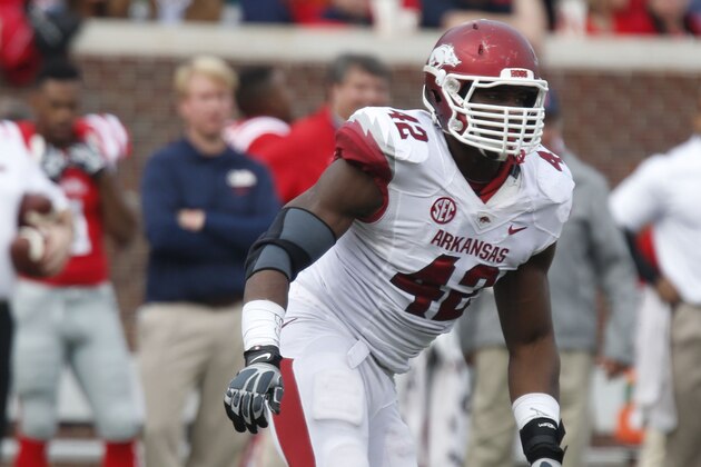 Arkansas defensive end Chris Smith (42) sets up for play against Mississippi during the second half of their NCAA college football game at Vaught-Hemingway Stadium in Oxford, Miss., on Saturday, Nov. 9, 2013. Mississippi won 34-24. (AP Photo/Rogelio V. Solis)