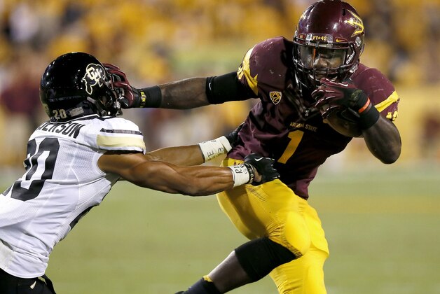 Arizona State's Marion Grice (1) stiff-arms Colorado's Greg Henderson while running with the ball during the first half of an NCAA college football game on Saturday Oct. 12, 2013, in Tempe, Ariz. (AP Photo/Ross D. Franklin)