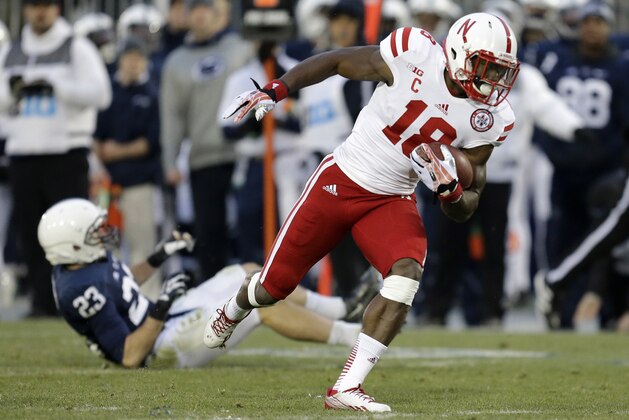 Nebraska wide receiver Quincy Enunwa (18) heads for the end zone after taking a pass from Nebraska quarterback Ron Kellogg III in the second-quarter of an NCAA college football game against Penn State in State College, Pa., Saturday, Nov. 23, 2013. (AP Photo/Gene J. Puskar)