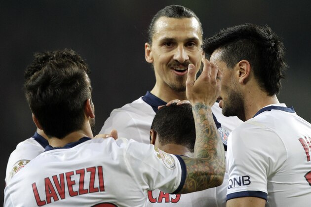 PSG's players celebrate the second goal during their French League one soccer match against Lille at the Lille Metropole stadium, in Villeneuve d'Ascq, northern France, Saturday, May 10, 2014. Paris Saint-Germain have  won their second straight French league title. (AP Photo/Michel Spingler)