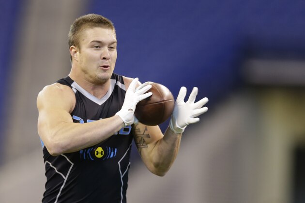 UCLA linebacker Jordan Zumwalt runs a drill at the NFL football scouting combine in Indianapolis, Monday, Feb. 24, 2014. (AP Photo/Michael Conroy)