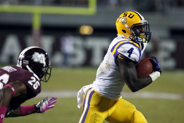 LSU running back Alfred Blue (4) runs past Mississippi State defensive back Kendrick Market (26) for a 17-yard touchdown run in the second half of their NCAA college football game in Starkville, Miss., Saturday, Oct. 5, 2013. No. 10 LSU won 59-26. (AP Photo/Rogelio V. Solis)