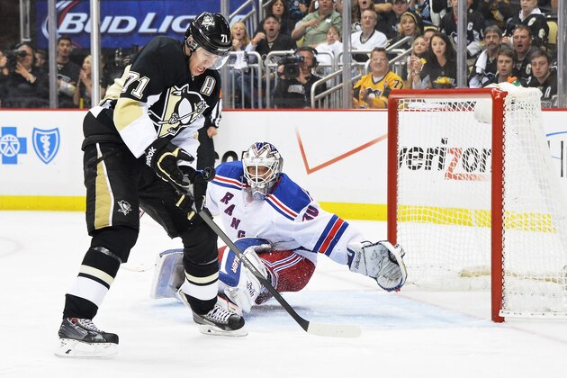 PITTSBURGH, PA - MAY 9:  Evgeni Malkin #71 of the Pittsburgh Penguins catches the puck on the rebound off his own shot before turning around and scoring on a second shot on goaltender Henrik Lundqvist #30 of the New York Rangers in the second period in Game Five of the Second Round of the 2014 NHL Stanley Cup Playoffs on May 9, 2014 at CONSOL Energy Center in Pittsburgh, Pennsylvania.  (Photo by Jamie Sabau/Getty Images)