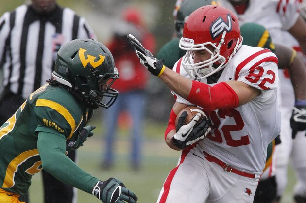 Saginaw Valley wide receiver Jeff Janis (82) is pursued by Wayne State safety David Churchwell during the fourth quarter of their Division II NCAA football game Saturday, Oct. 19, 2013, in Detroit. Janis scored two touchdowns in Saginaw Valley's 14-10 win over Wayne State. (AP Photo/Duane Burleson)