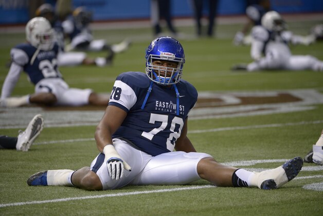 West offensive tackle Charles Leno, Jr. (78), of Boise State, stretches prior to the East-West Shrine Classic NCAA football game in St. Petersburg, Fla., Saturday, Jan. 18, 2014.(AP Photo/Phelan M. Ebenhack)