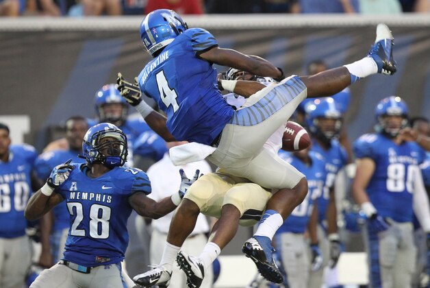 Oct 5, 2013; Memphis, TN, USA; Memphis Tigers defensive backs Andrew Gaines (28) and Lonnie Ballentine (4) defend against a pass intended for UCF Knights wide receiver Rannell Hall (6) during the second half at Liberty Bowl Memorial. UCF defeated Memphis 24-17. Mandatory Credit: Nelson Chenault-USA TODAY Sports