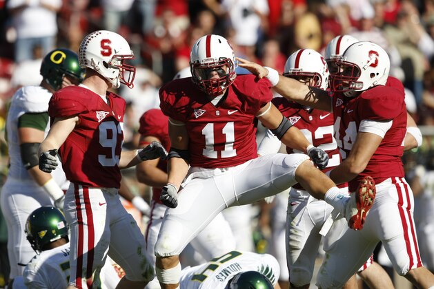 Stanford linebacker Shane Skov (11) celebrates after bringing down Oregon's LaMichael James during the second quarter of an NCAA college football game in Stanford, Calif., Saturday, Nov. 7, 2009. (AP Photo/Marcio Jose Sanchez)