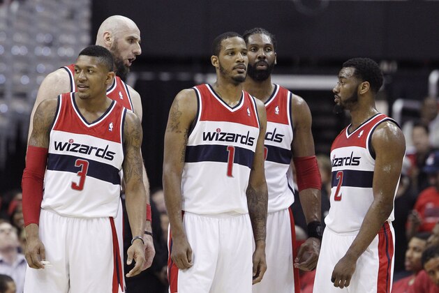 Washington Wizards (l-r) Bradley Beal, Marcin Gortat, Trevor Ariza, Nene, and John Wall stand on the court during a break in the action during the first half of Game 3 of an Eastern Conference semifinal NBA basketball playoff game against the Indiana Pacers in Washington, Friday, May 9, 2014. (AP Photo/Alex Brandon)