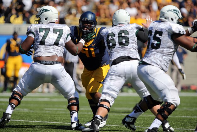 Sep 7, 2013; Berkeley, CA, USA; California Golden Bears defensive lineman Deandre Coleman (91) holds off Portland State Vikings offensive linesman Cornelius Edison (77) and offensive linesman Mitch Gaulke (66) during the first quarter at Memorial Stadium. Mandatory Credit: Kelley L Cox-USA TODAY Sports