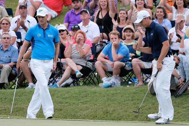 PONTE VEDRA BEACH, FL - MAY 10:  Jordan Spieth of the United States (R) saves par on the 18th hole as Martin Kaymer of Germany look on during the third round of THE PLAYERS Championship on the stadium course at TPC Sawgrass on May 10, 2014 in Ponte Vedra Beach, Florida.  (Photo by Kevin C. Cox/Getty Images)