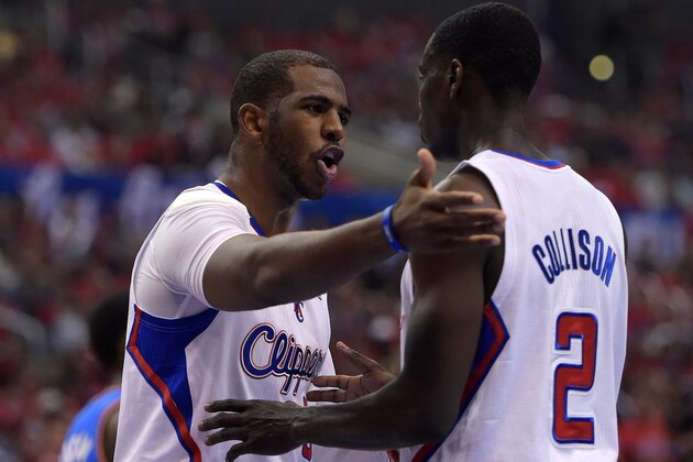 Los Angeles Clippers guard Chris Paul, left, talks with guard Darren Collison in the first half of Game 3 of the Western Conference semifinal NBA basketball playoff series against the Oklahoma City Thunder, Friday, May 9, 2014, in Los Angeles. (AP Photo/Mark J. Terrill)