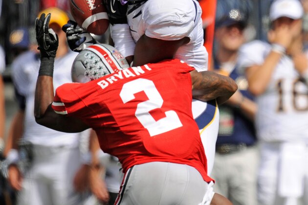 COLUMBUS, OH - SEPTEMBER 15:  Christian Bryant #2 of the Ohio State Buckeyes hits C.J. Anderson #9 of the California Golden Bears just as Bryant attempts to receive the ball at Ohio Stadium on September 15, 2012 in Columbus, Ohio. The pass was incomplete.  (Photo by Jamie Sabau/Getty Images)