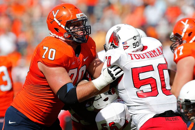 Oct 5, 2013; Charlottesville, VA, USA; Virginia Cavaliers offensive linesman Luke Bowanko (70) blocks Ball State Cardinals linebacker Trent Toothman (50) at Scott Stadium. Mandatory Credit: Geoff Burke-USA TODAY Sports