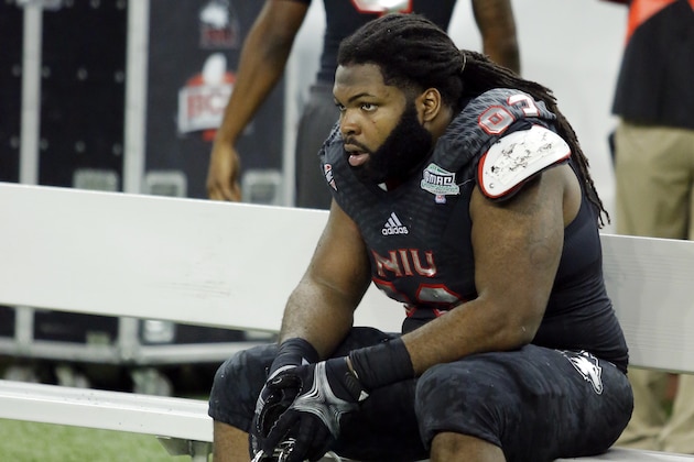 DETROIT, MI - DECEMBER 6: Defensive tackle Ken Bishop #93 of the Northern Illinois Huskies sits on the bench after a 47-27 loss to the Bowling Green Falcons in the MAC Championship at Ford Field on December 6, 2013 in Detroit, Michigan. (Photo by Duane Burleson/Getty Images)