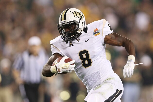 GLENDALE, AZ - JANUARY 01:  Storm Johnson #8 of the UCF Knights runs for a first quarter touchdown against the Baylor Bears during the Tostitos Fiesta Bowl at University of Phoenix Stadium on January 1, 2014 in Glendale, Arizona.  (Photo by Christian Petersen/Getty Images)