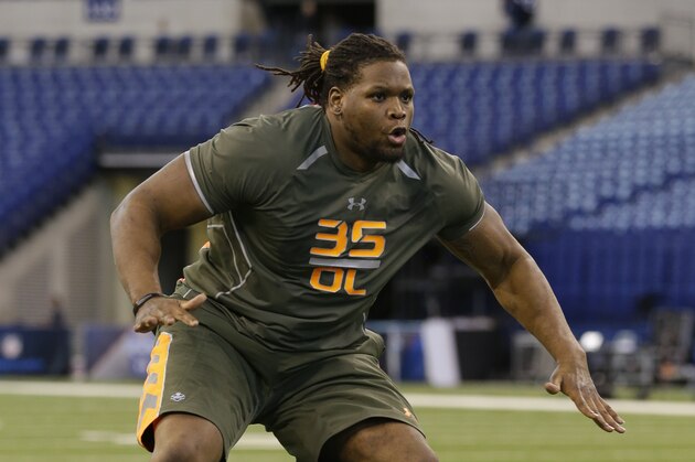 Tennessee offensive lineman Antonio Richardson runs a drill at the NFL football scouting combine in Indianapolis, Saturday, Feb. 22, 2014. (AP Photo/Michael Conroy)