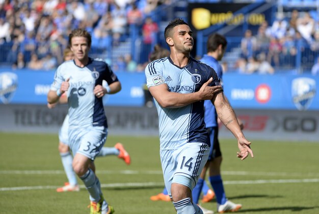 May 10, 2014; Montreal, Quebec, CAN; Sporting KC forward Dom Dwyer (14) reacts after scoring a goal against the Montreal Impact during the first half at Stade Saputo. Mandatory Credit: Eric Bolte-USA TODAY Sports