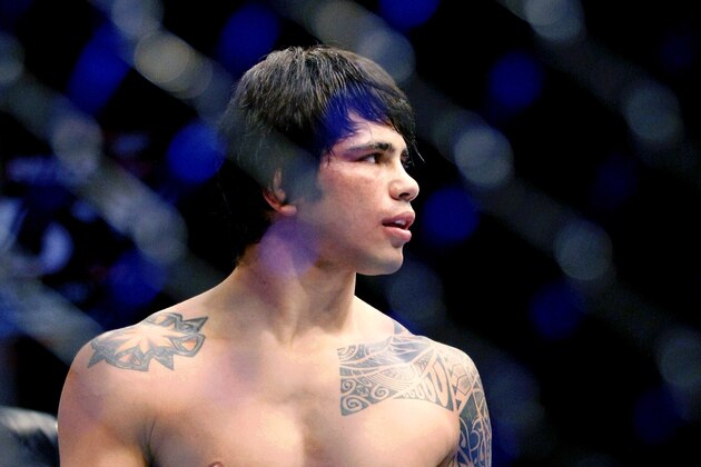 May 10, 2014; Cincinnati, OH, USA; Erick Silva (blue gloves) waits in the octagon before a welterweight bout at US Bank Arena. Mandatory Credit: Joe Maiorana-USA TODAY Sports