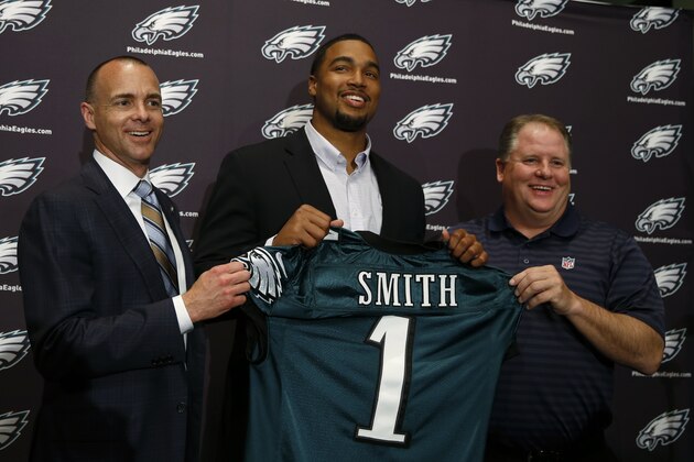 Newly-drafted Philadelphia Eagles' Marcus Smith, center, poses with team president Don Smolenski, left, and head coach Chip Kelly before an NFL football news conference at the team's practice facility, Friday, May 9, 2014, in Philadelphia. Smith was selected in the first round, 26th overall, by the Philadelphia Eagles in the NFL draft on Thursday, May 8, 2014. (AP Photo/Matt Slocum)