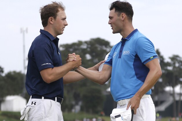 Jordan Spieth, left, and Martin Kaymer of Germany, shake hands at the end of the third round of The Players championship golf tournament at TPC Sawgrass, Saturday, May 10, 2014 in Ponte Vedra Beach, Fla. (AP Photo/Lynne Sladky)