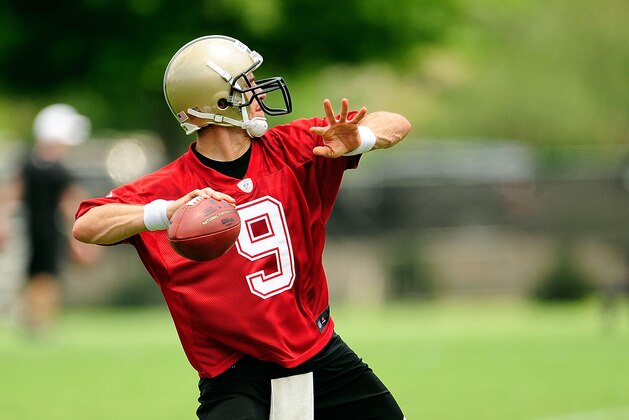 METAIRIE, LA - MAY 23:  Drew Brees #9 of the New Orleans Saints prepares to throw a pass during OTA's (organized team activities) at the Saints training facility on May 23, 2013 in Metairie, Louisiana.  (Photo by Stacy Revere/Getty Images)
