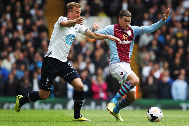 LONDON, ENGLAND - MAY 11:  Matthew Lowton (R) of Aston Villa holds off the challenge of Christian Eriksen (L) of Tottenham Hotspur during the Barclays Premier League match between Tottenham Hotspur and Aston Villa at White Hart Lane on May 11, 2014 in London, England.  (Photo by Clive Rose/Getty Images)