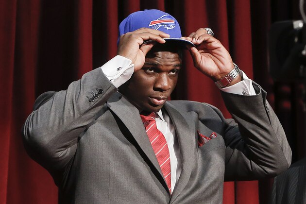 Alabama tackle Cyrus Kouandijo dons a Buffalo Bills cap after being selected as the 44th pick by the Bills in the second round of the 2014 NFL Draft, Friday, May 9, 2014, in New York. (AP Photo/Jason DeCrow)