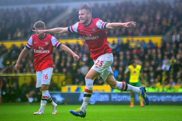 NORWICH, ENGLAND - MAY 11:  Carl Jenkinson of Arsenal celebrates scoring the second goal during the Barclays Premier League match between Norwich City and Arsenal at Carrow Road on May 11, 2014 in Norwich, England.  (Photo by Jamie McDonald/Getty Images)