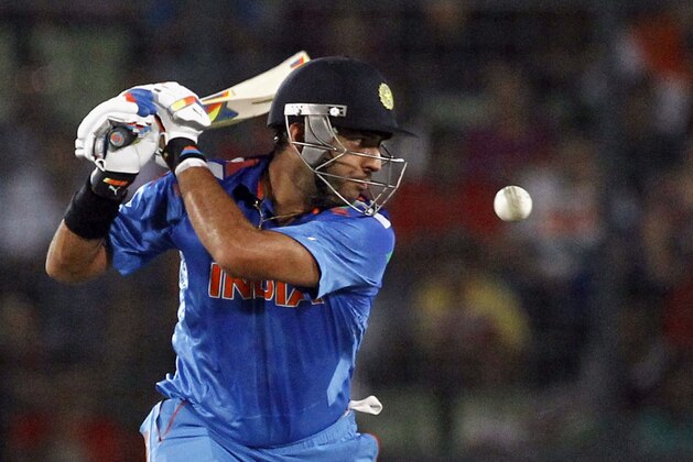 India's Yuvraj Singh plays a shot during their ICC Twenty20 Cricket World Cup final match against Sri Lanka in Dhaka, Bangladesh, Sunday, April 6, 2014. (AP Photo/A.M. Ahad)