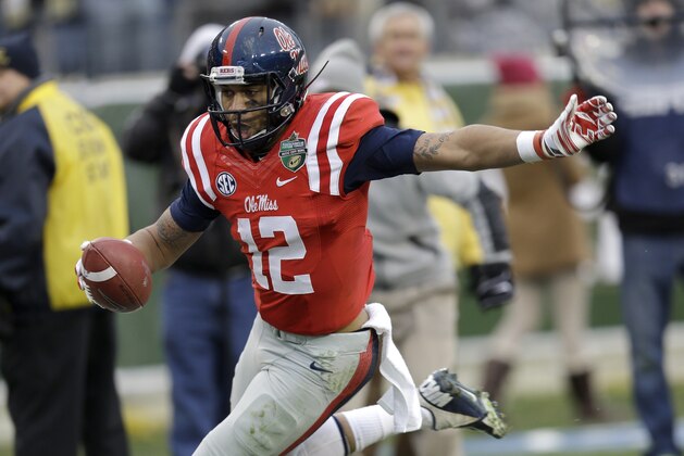 Mississippi wide receiver Donte Moncrief runs the ball into the end zone as he scores a touchdown on a 28-yard pass play against Georgia Tech in the second quarter of the NCAA college football Music City Bowl game on Monday, Dec. 30, 2013, in Nashville, Tenn. (AP Photo/Mark Humphrey)
