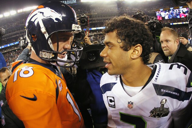 EAST RUTHERFORD, NJ - FEBRUARY 02:  (L-R) Quarterback Peyton Manning #18 of the Denver Broncos congratulates quarterback Russell Wilson #3 of the Seattle Seahawks on their 43-8 win during Super Bowl XLVIII at MetLife Stadium on February 2, 2014 in East Rutherford, New Jersey.  (Photo by Kevin C. Cox/Getty Images)