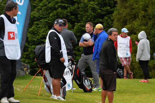 FUNCHAL, MADEIRA, PORTUGAL - MAY 11 :  Alastair Forsyth of Scotland (C), talks to fellow golfers after has caddie Ian McGregor tragically died on the 9th Fairway today, during the final round of the Madeira Islands Open - Portugal - BPI at Club de Golf do Santo da Serra on May 11, 2014 in Funchal, Madeira, Portugal. (Photo by Mark Runnacles/Getty Images)