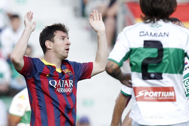 Barcelona's Lionel Messi from Argentina reacts after failing to score against Elche during a Spanish La Liga soccer match at the Martinez Valero stadium in Elche, Spain, on Sunday, May 11, 2014.(AP Photo/Alberto Saiz)