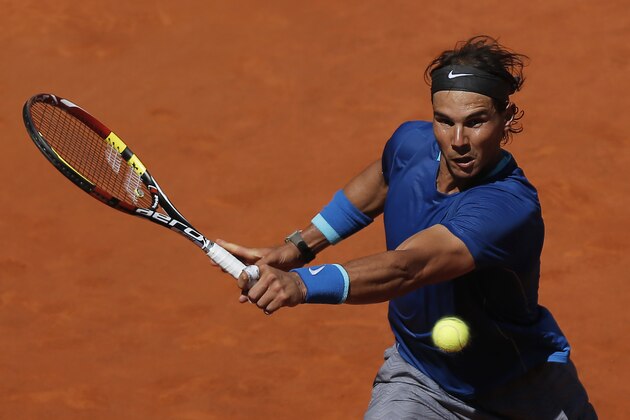 2Rafael Nadal from Spain returns the ball during a Madrid Open tennis tournament match against Tomas Berdych from Czech Republic in Madrid, Spain, Friday, May 9, 2014. (AP Photo/Andres Kudacki)