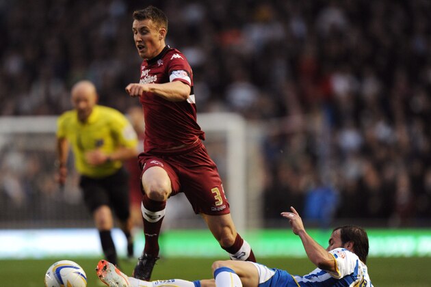BRIGHTON, ENGLAND - MAY 08: Craig Forsyth of Derby County is tackled by Inigo Calderon of Brighton & Hove Albion during the Sky Bet Championship Play Off semi final first leg match between Brighton & Hove Albion and Derby County at Amex Stadium on May 8, 2014 in Brighton, England.  (Photo by Steve Bardens/Getty Images)