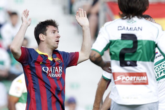 Barcelona's Lionel Messi from Argentina reacts after failing to score against Elche during a Spanish La Liga soccer match at the Martinez Valero stadium in Elche, Spain, on Sunday, May 11, 2014.(AP Photo/Alberto Saiz)