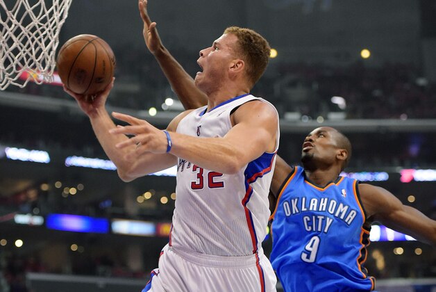 Los Angeles Clippers forward Blake Griffin, left, goes up for a shot as Oklahoma City Thunder forward Serge Ibaka, of Congo, defends in the first half of Game 3 of the Western Conference semifinal NBA basketball playoff series, Friday, May 9, 2014, in Los Angeles. (AP Photo/Mark J. Terrill)