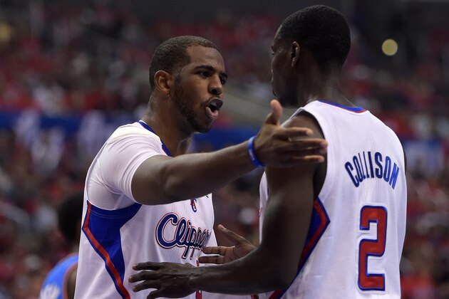 Los Angeles Clippers guard Chris Paul, left, talks with guard Darren Collison in the first half of Game 3 of the Western Conference semifinal NBA basketball playoff series against the Oklahoma City Thunder, Friday, May 9, 2014, in Los Angeles. (AP Photo/Mark J. Terrill)