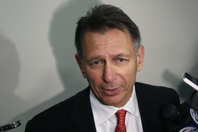 Detroit Red Wings General Manager Ken Holland addresses the media after participating in the team photo at Joe Louis Arena in Detroit, Tuesday, April 29, 2014. The Red Wings were eliminated by the Boston Bruins in the first round of the Stanley Cup hockey playoffs. (AP Photo/Carlos Osorio)