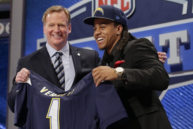 Texas Christian cornerback Jason Verrett reacts with NFL commissioner Roger Goodell after being selected by the San Diego Chargers as the 25th pick of the first round of the 2014 NFL Draft, Thursday, May 8, 2014, in New York. (AP Photo/Craig Ruttle)