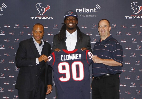 HOUSTON, TX - MAY 09:  Jadeveon Clowney (C) displays his Houston Texans jersey with general manager Rick Smith (L) and Houston Texans head coach Bill O'Brien (R) at Reliant Stadium on May 9, 2014 in Houston, Texas. Clowney was selected by the Texans with the first overall pick in the 2014 NFL draft. (Photo by Bob Levey/Getty Images)