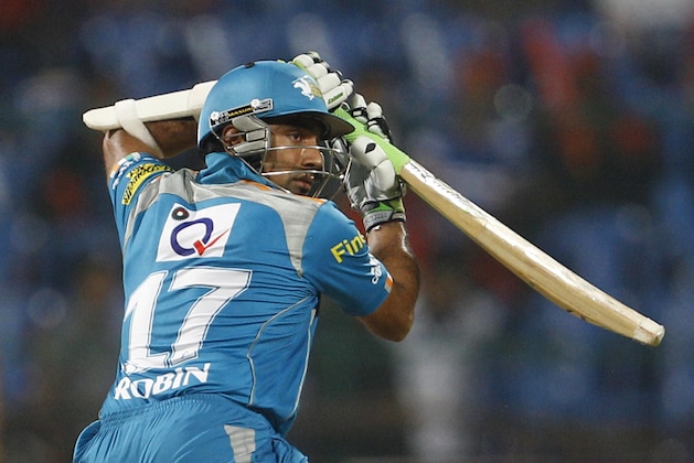 Pune Warriors batsman Robin Uthappa watches his shot during their Indian Premier League (IPL) cricket match against Royal Challengers Bangalore in Bangalore, India, Tuesday, April 17, 2012. (AP Photo/Aijaz Rahi)