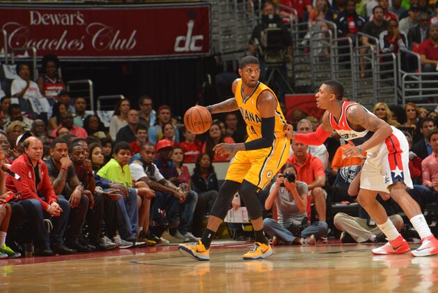 OKLAHOMA CITY, OK - MAY 11: Paul George #24 of the Indiana Pacers dribbles the ball against the Washington Wizards during Game Four of the Western Conference Semifinals on May 11, 2014 at the Verizon Center, in Washington DC. NOTE TO USER: User expressly acknowledges and agrees that, by downloading and or using this Photograph, user is consenting to the terms and conditions of the Getty Images License Agreement. Mandatory Copyright Notice: Copyright 2014 NBAE (Photo by Jesse D. Garrabrant/NBAE via Getty Images)
