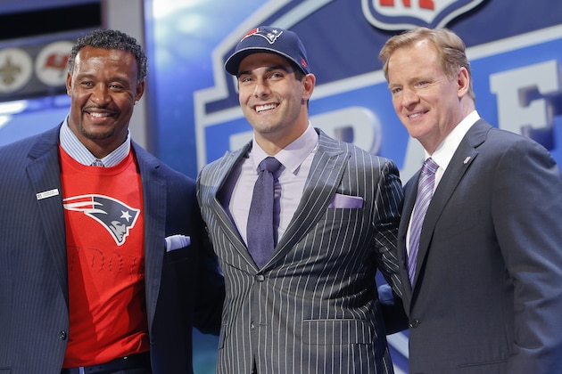 Eastern Illinois quarterback Jimmy Garoppolo poses for photos with NFL commissioner Roger Goodell and former New England Patriots linebacker Willie McGinest after being selected as the 62nd pick by the New England Patriots in the second round of the 2014 NFL Draft, Friday, May 9, 2014, in New York. (AP Photo/Jason DeCrow)